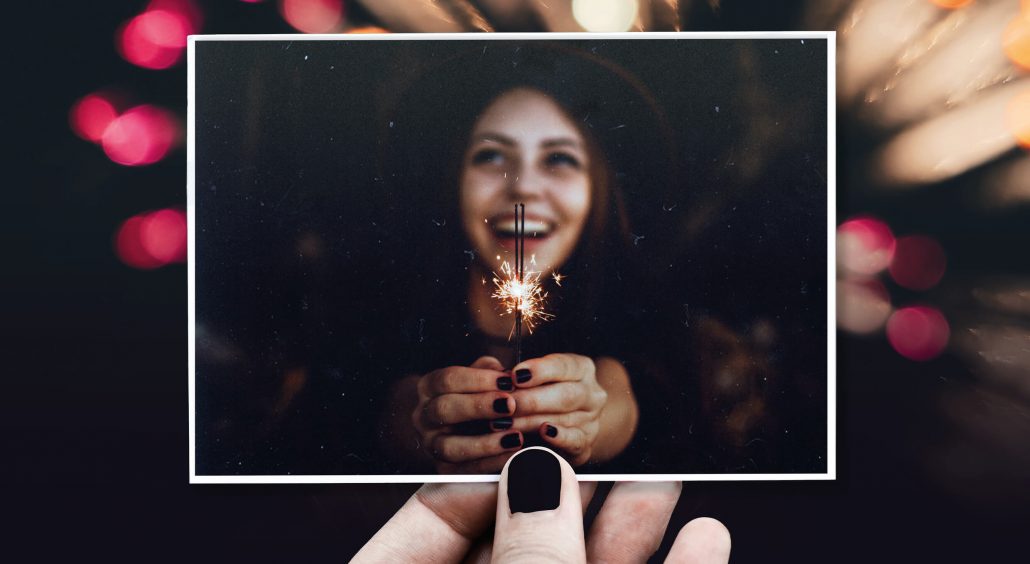 New Year card
Laughing woman holding sparkler