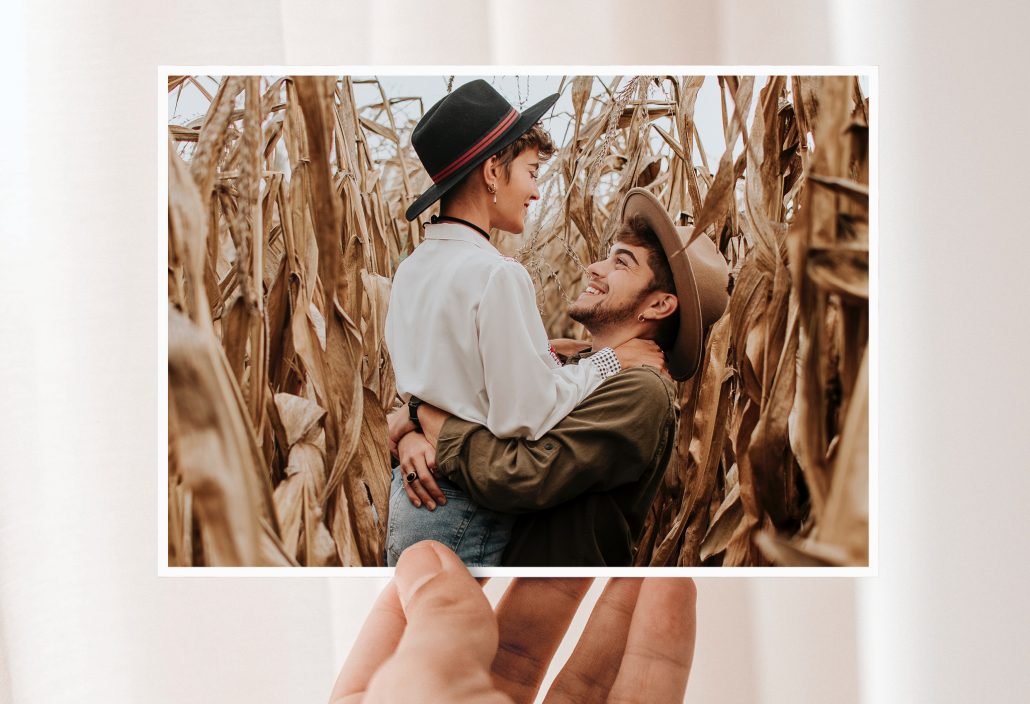 Anniversary cards with a happy couple in a cornfield